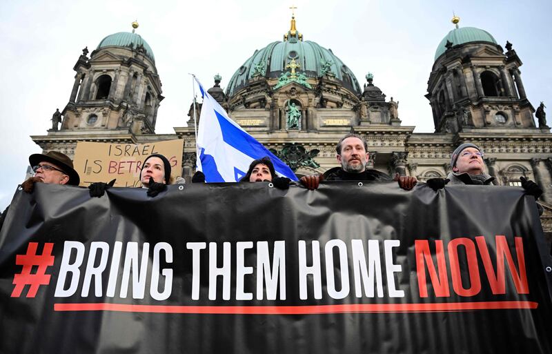 Demonstrators demand the release of Israeli hostages in Gaza as they march past the Berlin Cathedral. AFP
