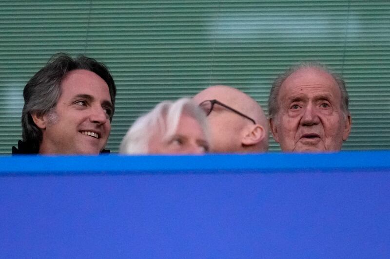 Former Spanish monarch King Juan Carlos, right, before the game. AP 