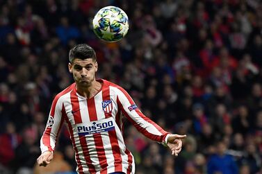 (FILES) In this file photo taken on October 22, 2019, Atletico Madrid's Spanish forward Alvaro Morata heads the ball to score a goal during the UEFA Champions League Group D football match between Atletico Madrid and Bayer Leverkusen at the Wanda Metropolitano stadium in Madrid. Juventus officially signed Alvaro Morata on loan, AFP learnt on September 22, 2020. / AFP / OSCAR DEL POZO
