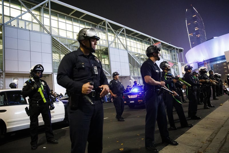 Los Angeles Police Department officers form a line in front of demonstrators during the 2020 Presidential election in Los Angeles, California. Bloomberg
