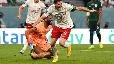 Poland's forward #09 Robert Lewandowski (R) celebrates scoring his team's second goal during the Qatar 2022 World Cup Group C football match between Poland and Saudi Arabia at the Education City Stadium in Al-Rayyan, west of Doha on November 26, 2022.  (Photo by ANDREJ ISAKOVIC  /  AFP)