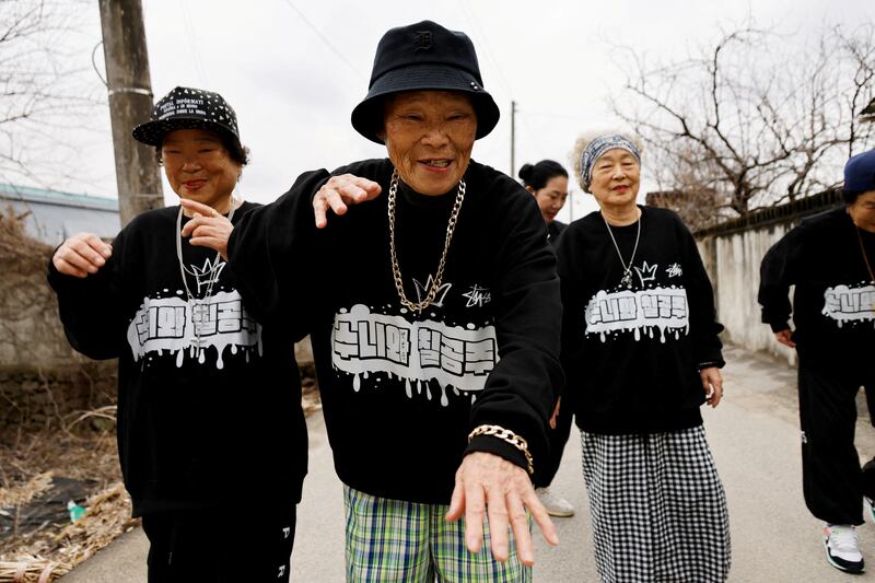 Park Jeom-sun, 81, the leader of the granny rap group "Suni and Seven Princesses", along with members Hong Sun-yeon, 79, and Jeong Du-i, 90, raps on the street in Chilgok, South Korea, February 6, 2024.  REUTERS / Kim Soo-hyeon     TPX IMAGES OF THE DAY