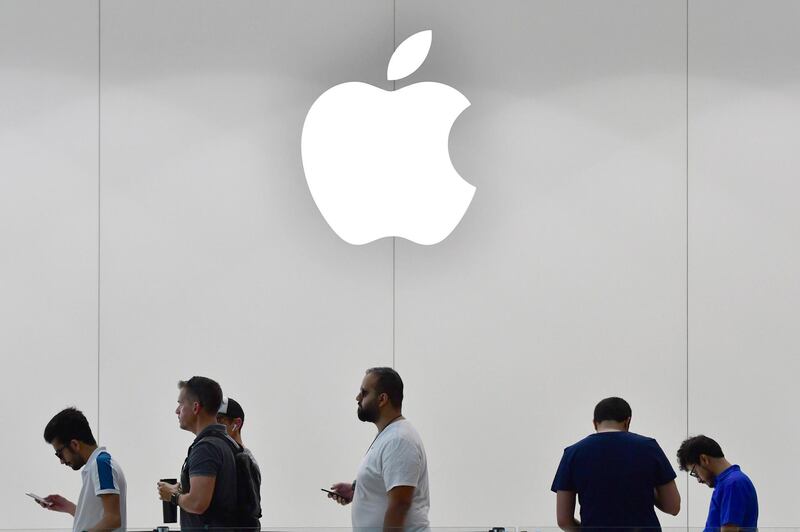 Customers stand in line to purchase the new Apple iPhone 8 at Dubai Mall Apple Store in Dubai, on September 23, 2017.
The new Apple iPhone 8 and 8 Plus, as well as the updated Apple Watch and Apple TV, went on sale today. / AFP PHOTO / GIUSEPPE CACACE