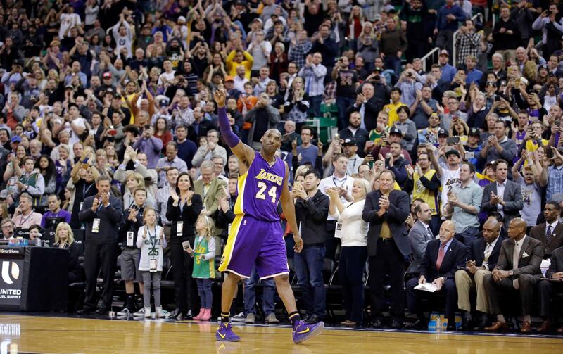 Los Angeles Lakers forward Kobe Bryant (24) waves as he walks off the court during the second half of an NBA basketball game in Salt Lake City. AP Photo