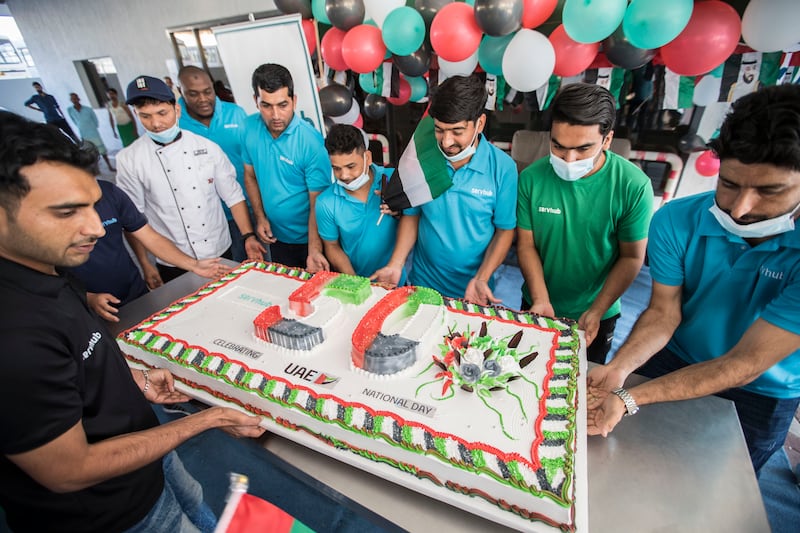 The workers were presented with a giant cake, measuring 1.5 metres.