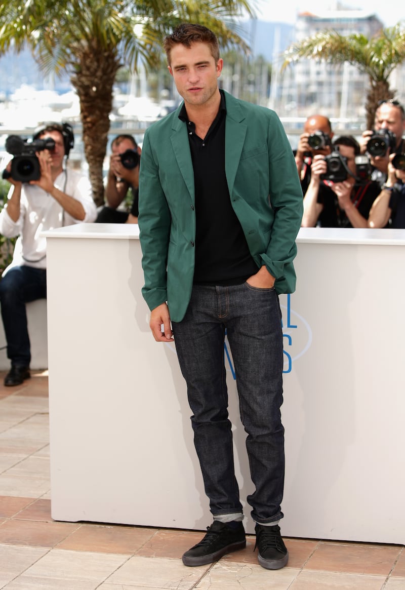 A modern look in a green sports jacket and black polo shirt and jeans, at 'The Rover' photocall during the 67th Annual Cannes Film Festival on May 18, 2014. Getty Images