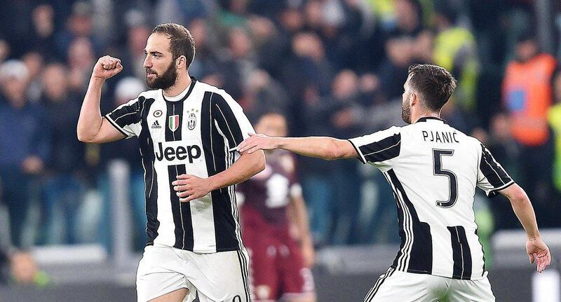 Juventus' Gonzalo Higuain, left, celebrates with his teammate Miralem Pjanic after scoring the 1-1 equaliser during the Italian Serie A match against Torino at Juventus Stadium in Turin, Italy, 06 May 2017. Alessandro Di Marco / EPA