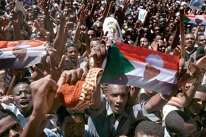 A crowd supporting Sudan's president Omar al Bashir chants slogan during a protest in Khartoum, on March 5 2009.