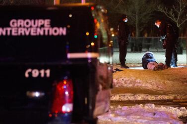 Police detain a protester as they enforce a night curfew imposed by the Quebec government to help slow the spread of the coronavirus disease (COVID-19) pandemic in Montreal, Quebec, Canada January 9, 2021. REUTERS/Christinne Muschi