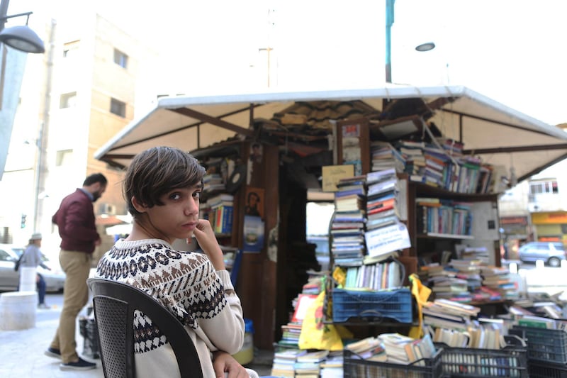Mohamad Al Maayteh, nefue of Hisham Al Maayteh keeps his uncle's Al Jahiz library's Kiosk open after his death. Hisham Al Maayteh, a Jordanian bookseller died a month after his bookstore was burnt out, in Amman, Jordan. (Salah Malkawi for The National)