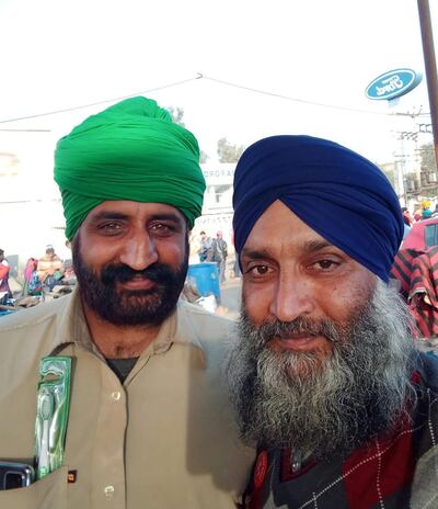 Narpinder Singh, left, with fellow farmer Balwinder Singh at the protests outside New Delhi, India. 