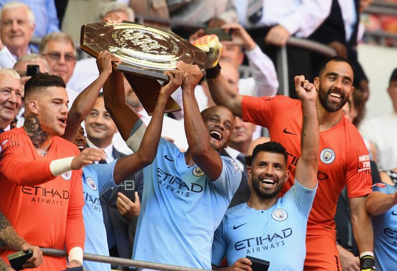 LONDON, ENGLAND - AUGUST 05:  The Manchester City players celebrate as Vincent Kompany and Fernandinho lift the Community Shield trophy during the FA Community Shield between Manchester City and Chelsea at Wembley Stadium on August 5, 2018 in London, England.  (Photo by Clive Mason/Getty Images)