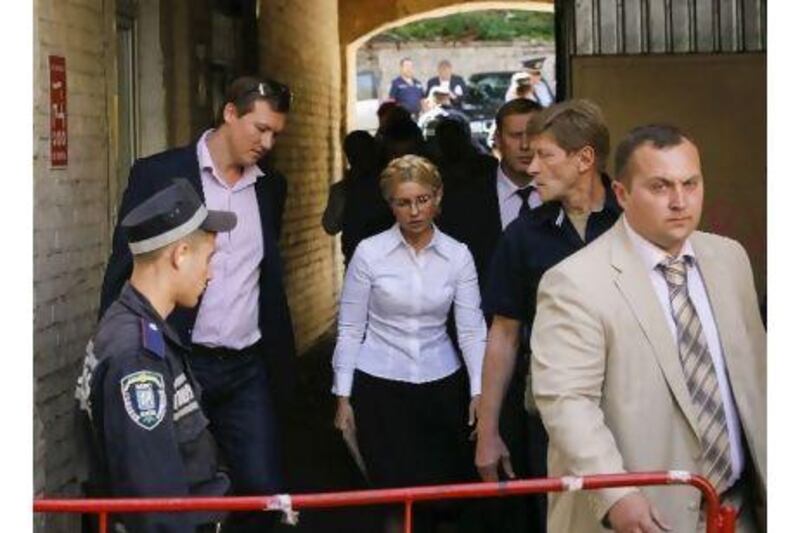 Yulia Tymoshenko, centre, formerly the Ukrainian prime minister, has been arrested for failing to acknowledge the legitimacy of her trial. A reader says the arrest shows she cannot get a fair trial. Reuters / Sergei Svetlitsky