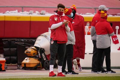 Kansas City Chiefs quarterback Patrick Mahomes watches from the sideline during the first half of an NFL football game against the Los Angeles Chargers, Sunday, Jan. 3, 2021, in Kansas City. (AP Photo/Jeff Roberson)