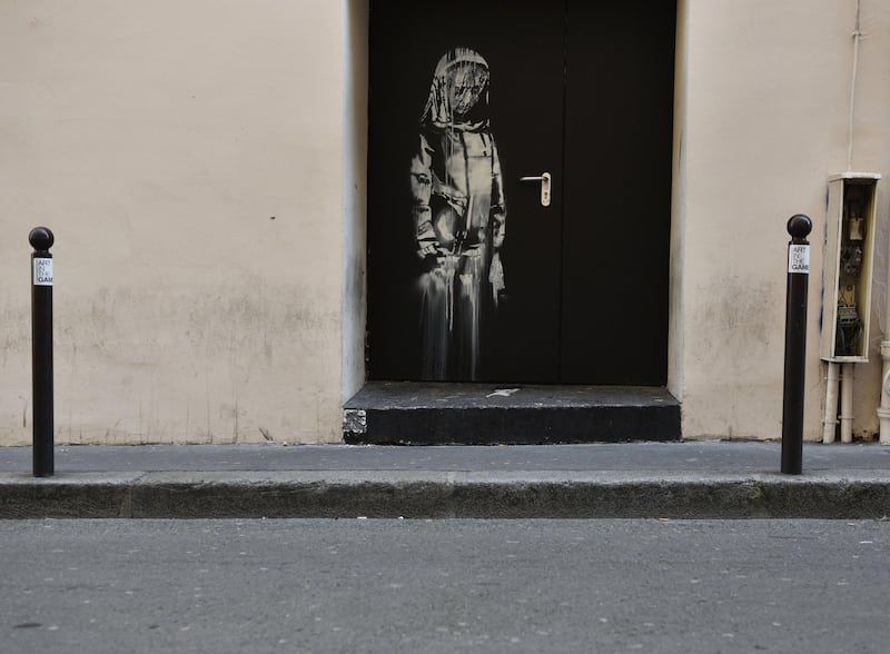 epa07322898 (FILE) A recent artwork believed to be attributed to Banksy is of a woman veiled in mourning next to the Bataclan concert venue in Paris, France, 26 June 2018 (reissued 26 January 2019). According to reports on 26 January, Banksy's mural located on the door to Bataclan concert hall, where 90 people have been killed in a terror attack in 2015, has been stolen.  EPA/JULIEN DE ROSA