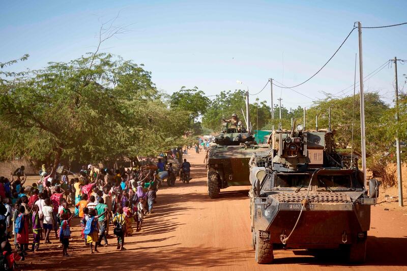 (FILES) In this file photo taken on November 14, 2019 Soldiers of the French Army patrols the village Gorom Gorom in Armoured Personnel Carriers during the Barkhane operation in northern Burkina Faso. French President Emmanuel Macron will travel on June 30, 2020 to Nouakchott in Mauritania to participate in a G5 Sahel summit to review the anti-Jihadist struggle in this region where more than 5,000 French soldiers are deployed.
This meeting in the Mauritanian capital will be held 6 months after the summit in Pau (Southwest of France) where it was decided to intensify the anti-Jihadist struggle in a context of generalized deterioration of the security situation of particularly poor Sahelian countries.
 / AFP / MICHELE CATTANI
