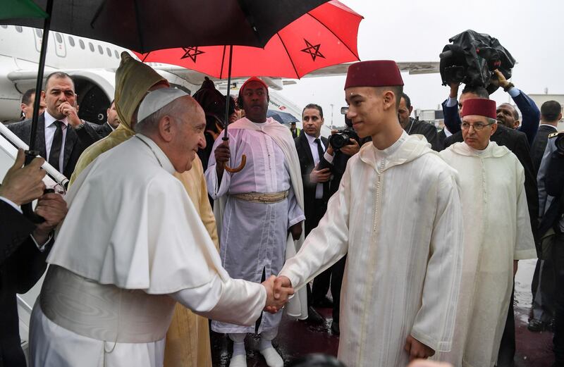 Pope Francis is greeted by Crown Prince Moulay Hassan. Reuters