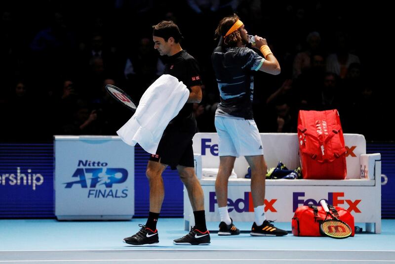 Roger Federer, left,  and Stefanos Tsitsipas. Reuters