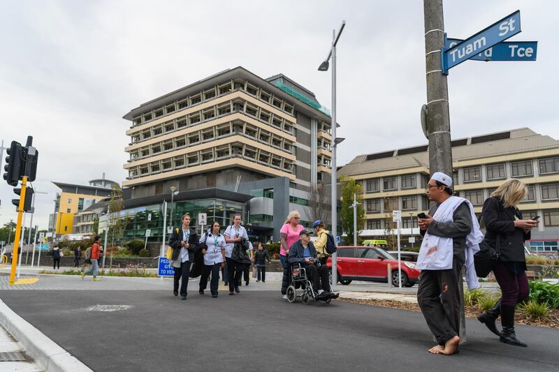 CHRISTCHURCH, NEW ZEALAND - MARCH 15: Hamzah Noor Yahaya, a survivor of the shootings at Al Noor mosque, stands in front of Christchurch Hospital at the end of a lockdown and waits to be picked up by his wife on March 15, 2019 in Christchurch, New Zealand. Four people are in custody following shootings at two mosques in the city. Police have not confirmed how many people were killed in the attack. The deaths occurred at Al Noor mosque and the Linwood Masjid in Christchurch. (Photo by Kai Schwoerer/Getty Images)