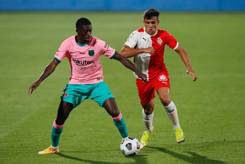 Barcelona's Ousmane Dembele, left, and Joel Priego of Girona. Reuters