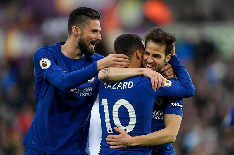 SWANSEA, WALES - APRIL 28:  Cesc Fabregas of Chelsea celebrates with teammates Olivier Giroud and Eden Hazard after scoring his sides first goal during the Premier League match between Swansea City and Chelsea at Liberty Stadium on April 28, 2018 in Swansea, Wales.  (Photo by Stu Forster/Getty Images)