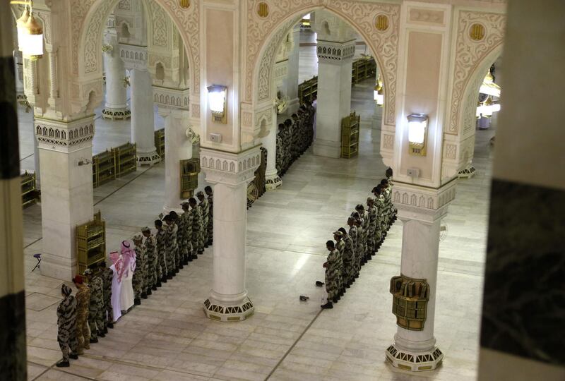 Members of the Saudi armed forces attend prayers at a mosque in Saudi Arabia's holy city of Makkah on April 3, 2020. AFP