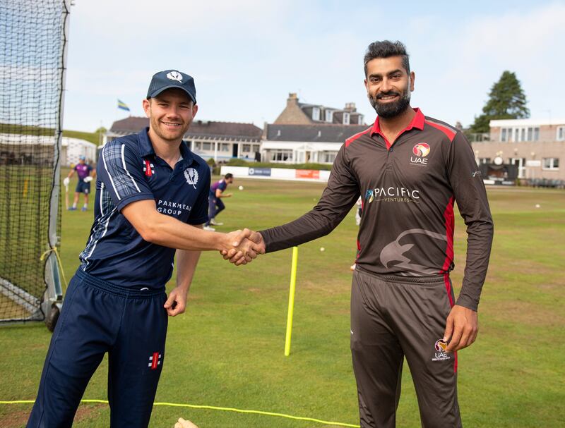 Scotland captain Matthew Cross and UAE skipper Ahmed Raza shake hands before the match.