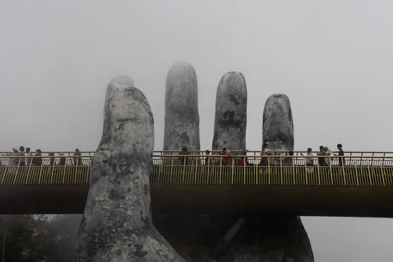 Tourists on the Golden Bridge in Da Nang, Vietnam. Bloomberg