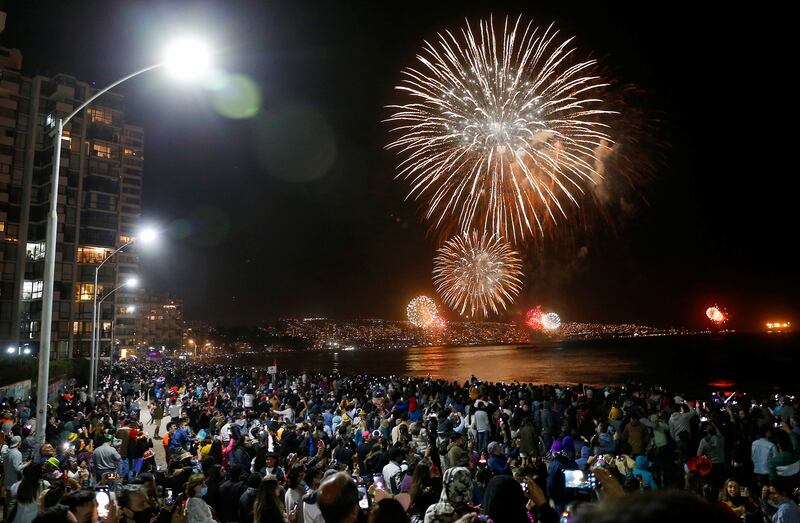 People gather to watch fireworks during New Year celebrations in the coastal city of Vina del Mar, Chile. Reuters