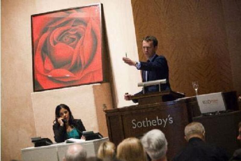 Tobias Meyer auctions a piece by Robert Longo from the Lehman Brothers' collection at Sotheby's in New York. Michael Nagle /Getty Images / AFP