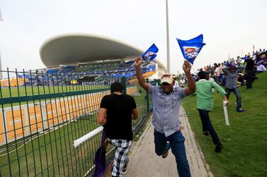 ABU DHABI - UNITED ARAB EMIRATES - 16APR2014 - IPL fans cheer during the first match of IPL 2014 yesterday at Zayed Cricket Stadium in Abu Dhabi. Ravindranath K / The National