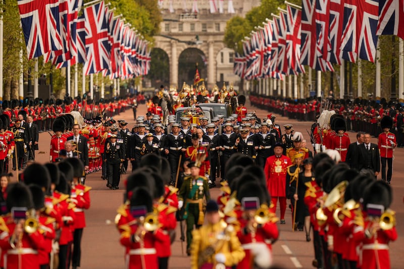 The coffin of Queen Elizabeth is pulled along The Mall following her funeral service in Westminster Abbey. AP