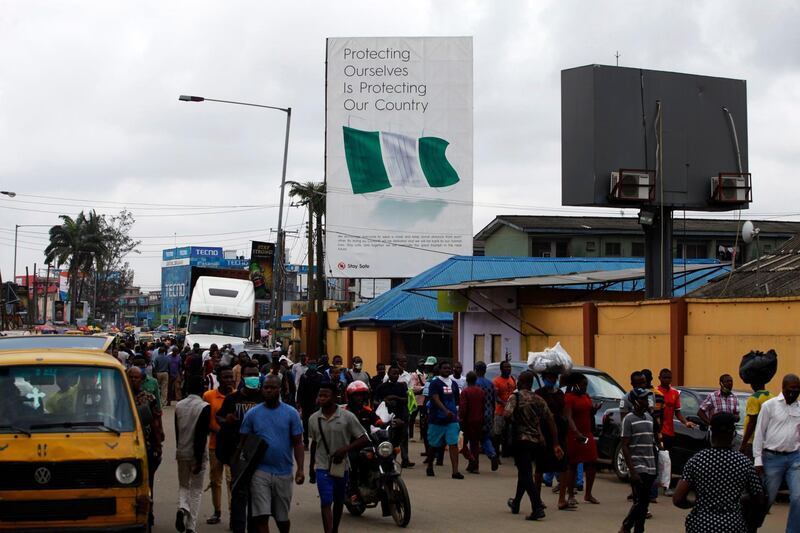 A billboard campaigning for the prevention of the coronavirus is seen standing in a neigbourhood in Lagos, Nigeria, this month. EPA