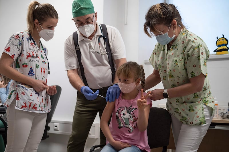 A young girl receives a vaccine at the Szent Lazar County Hospital in Salgotarjan, Hungary. EPA