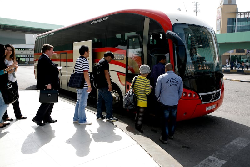 Abu Dhabi, UAE, 30th Jan. 2013: Travelers board the bus, that makes hourly trips from Abu Dhabi to Dubai and back, from the Abu Dhabi bus station, Airport Road, Abu Dhabi, 30th Jan. 2013 . Srijita Chattopadhyay / The National