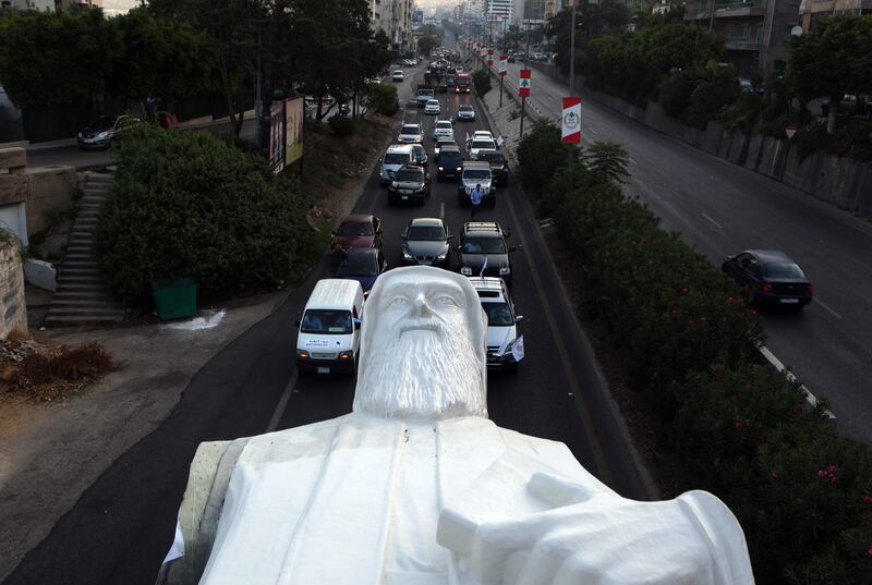A statue of Lebanese Christian Maronite monk Saint Charbel, weighing 40 tonnes and measuring 23 metres, being transported on the Jounieh highway to the town of Faraya north east of Beirut. Saint Charbel Makhlouf was a Maronite monk and priest who obtained a wide reputation for holiness during his life and was canonised by the Catholic Church. Patrick Baz / AFP