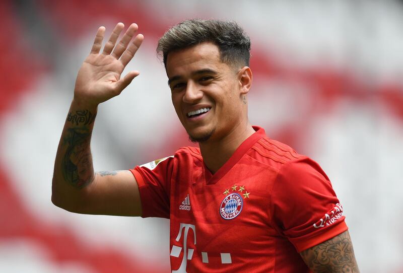Philippe Coutinho poses in a Bayern Munich strip at the club's Allianz Arena. Reuters
