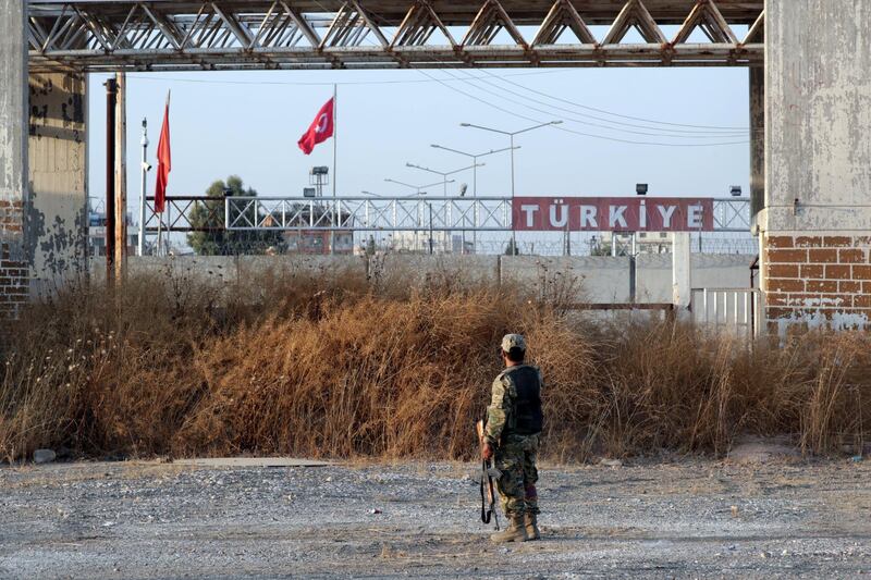 A Turkey-backed Syrian rebel fighter is seen in the town of Tal Abyad, Syria. Reuters