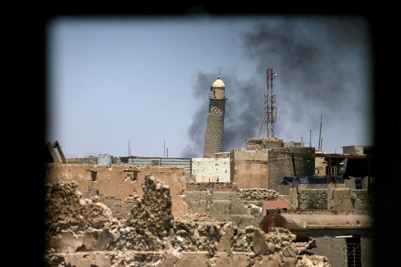 The leaning minaret of Iraq’s Grand Al Nuri Mosque is seen through a window in the old city of Mosul on June 1, 2017, just weeks before it was destroyed by ISIL. Alaa Al Marjani / Reuters
