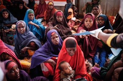 Mothers wait for high-nutrition food and health services at a camp for internally displaced people in Baidoa, Somalia. AFP