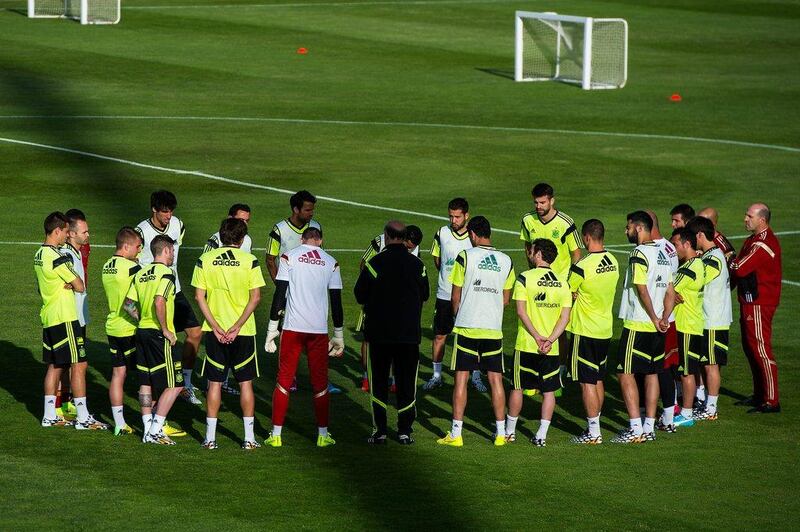 Spain players gather around coach Vicente del Bosque at Monday's team training session for the World Cup. David Ramos / Getty Images / May 26, 2014