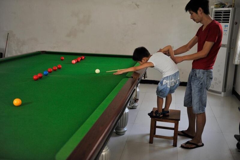 Yin has also discovered his son is ambidextrous and therefore can pocket balls with either hand. Reuters