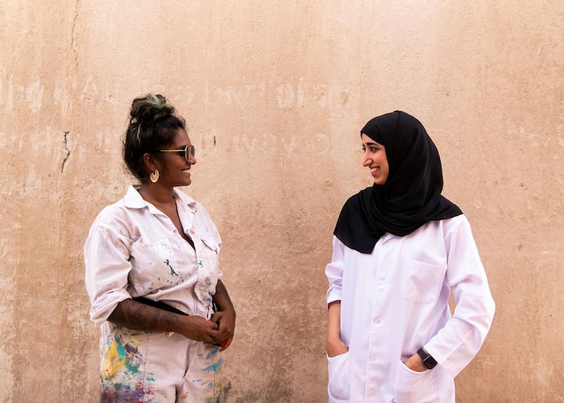 DUBAI, UNITED ARAB EMIRATES. 25 JULY 2020. 
Artists Amna Basheer,left, and Reem Al Mazrouei work on their commission for Dubai Culture. They are painting a “Hope mural” to celebrate the UAE Mars mission in Dubai’s Al Fahidi district. (Photo: Reem Mohammed/The National)

Reporter:
Section: