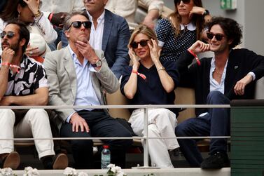 PARIS, FRANCE - JUNE 05: Actors Hugh Grant and Sienna Miller are seen in the stands during the Men's Singles Final match between Rafael Nadal of Spain and Casper Ruud of Norway on Day 15 of The 2022 French Open at Roland Garros on June 05, 2022 in Paris, France. (Photo by Adam Pretty / Getty Images)