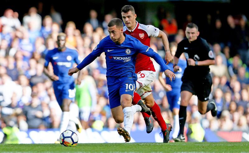 epa06210383 Chelsea's Eden Hazard (L) in action against Arsenal's Granit Xhaka (C) during the English Premier League soccer match between Chelsea FC and Arsenal FC at Stamford Bridge in London, Britain, 17 September 2017.  EPA/NEIL HALL EDITORIAL USE ONLY. No use with unauthorized audio, video, data, fixture lists, club/league logos or 'live' services. Online in-match use limited to 75 images, no video emulation. No use in betting, games or single club/league/player publications.