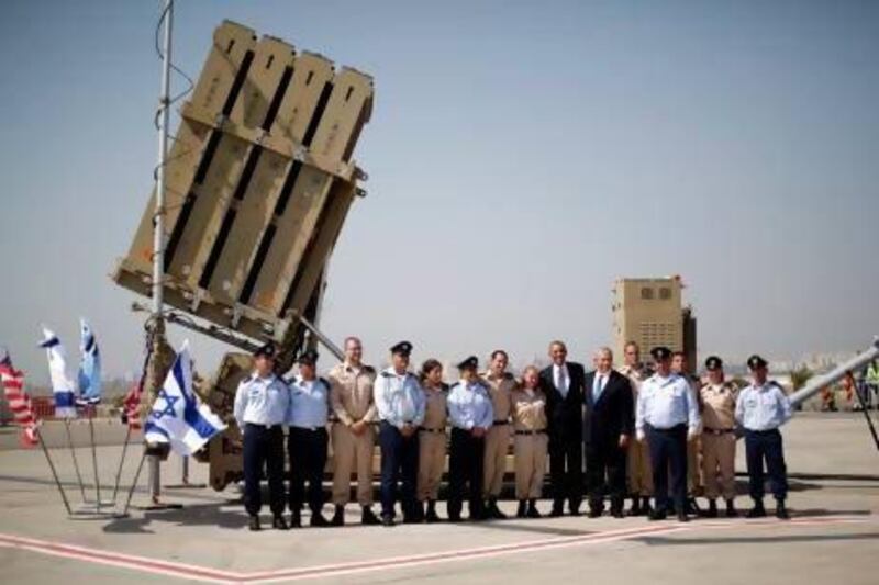 US president Barack Obama (7th from left) and Israeli prime minister Benjamin Netanyahu (6th) with members of Israel's defence force after viewing an Iron Dome Battery at Ben Gurion International Airport Airport in Tel Aviv.