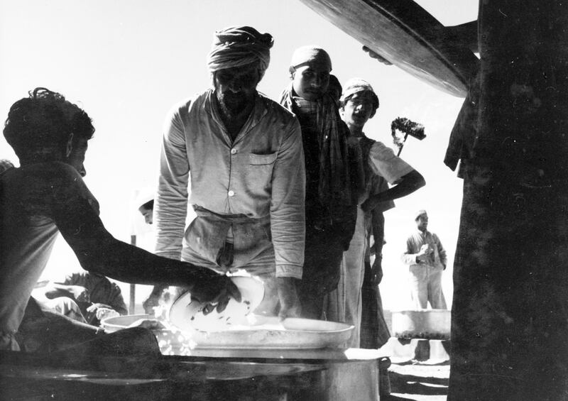 Arab workmen collect their midday meal on Das Island between 1953 to 1963  *** Local Caption *** *eds note* Mandatory Credit - Courtesy BP Archive