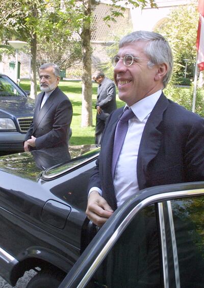 British Foreign Secretary Jack Straw (R) and Iranian Foreign Minister Kamal Kharazi arrive at the presidential palace in Tehran 25 September 2001. Straw, the most senior British official to visit Iran since the Islamic revolution in 1979, said that he was carrying no message from the United States as it prepares for military action against Afghanistan. (Photo by ATTA KENARE / AFP)