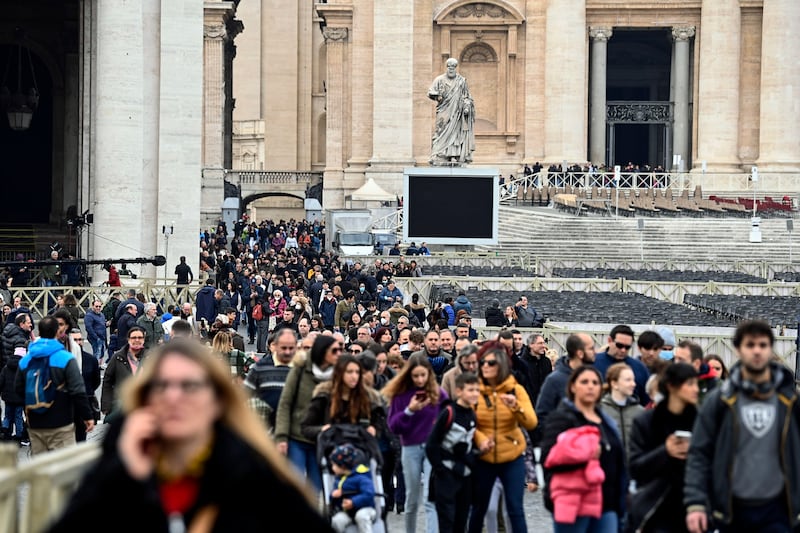 The faithful leave St Peter's Basilica after paying their respects to the late Pope Emeritus Benedict XVI. EPA