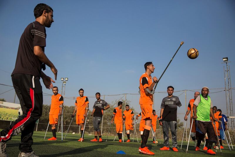 Palestinian players of Gaza's first amputee football team during a practice session held at the municipal ball field of Deir Al Balah ,Gaza on July 16,2018. The team meets weekly and hopes that they can help influence others with similar injuries to over come their disability .The team dreams to compete internationally . Many of the amputees were injured during conflicts with Israel .(Photo by Heidi Levine for The National).